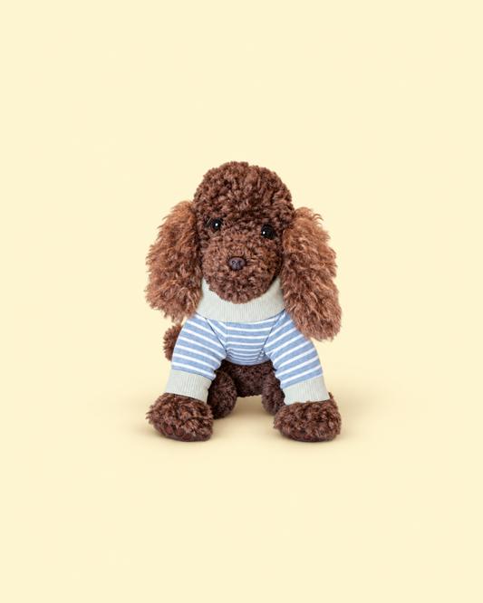 Comfort Me Raffy wears a blue and white striped, knitted onesie