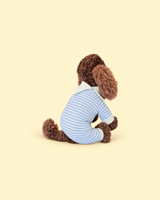 Comfort Me Raffy shows the reverse side of his blue and white striped, knitted onesie. It features an open grey collar detail on his neck