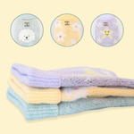 A 3 set of knitted jumpers specially designed for Comfort Me Raffy. One features a dog's face, one features white daisies and the final features a yellow star design
