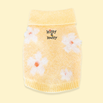 A yellow knit sweater for Comfort Me Raffy with white daisy patterns